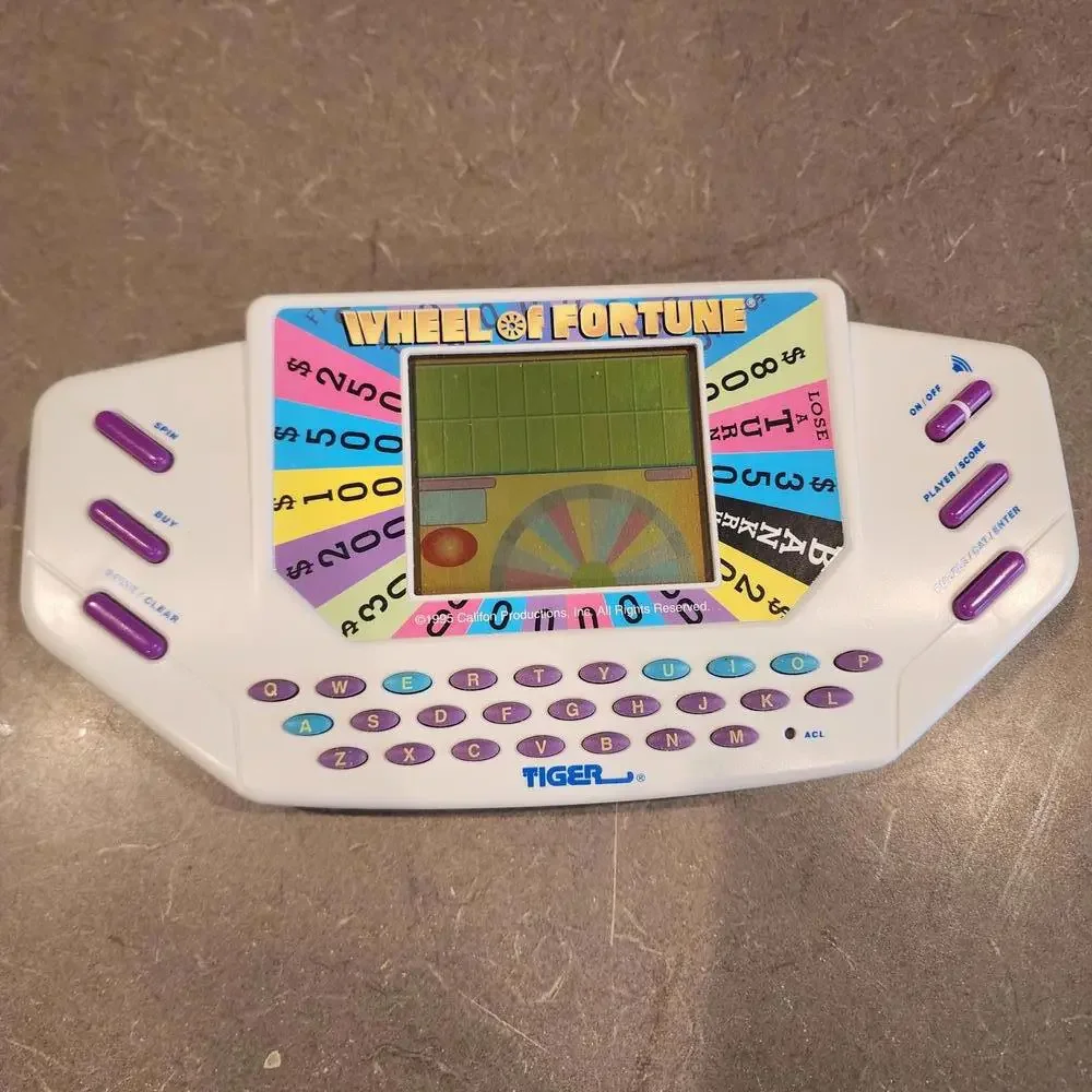 Wheel of Fortune Handheld Electronic Game works perfect EUC condition booklet